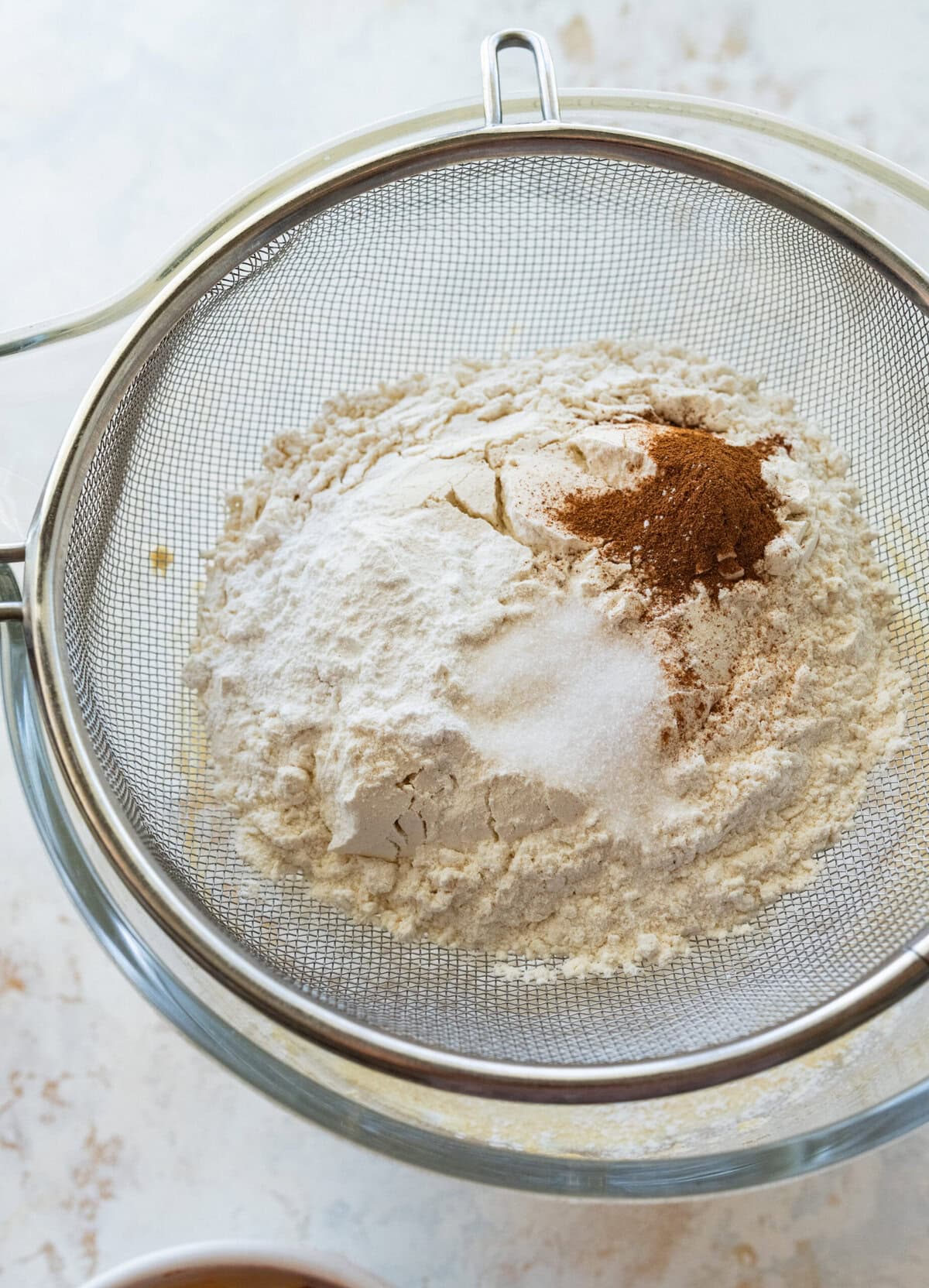 Flour, baking powder, and cinnamon added to the batter.