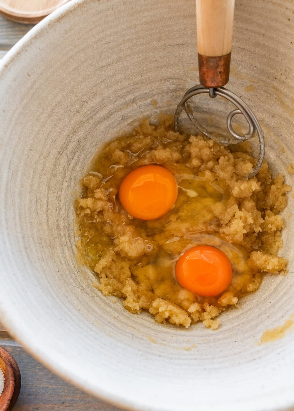 Eggs added on top of the muffin batter before mixed in.