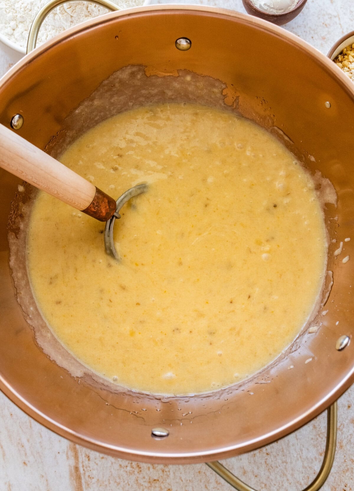 The wet ingredients for the banana nut cake batter in a bowl.