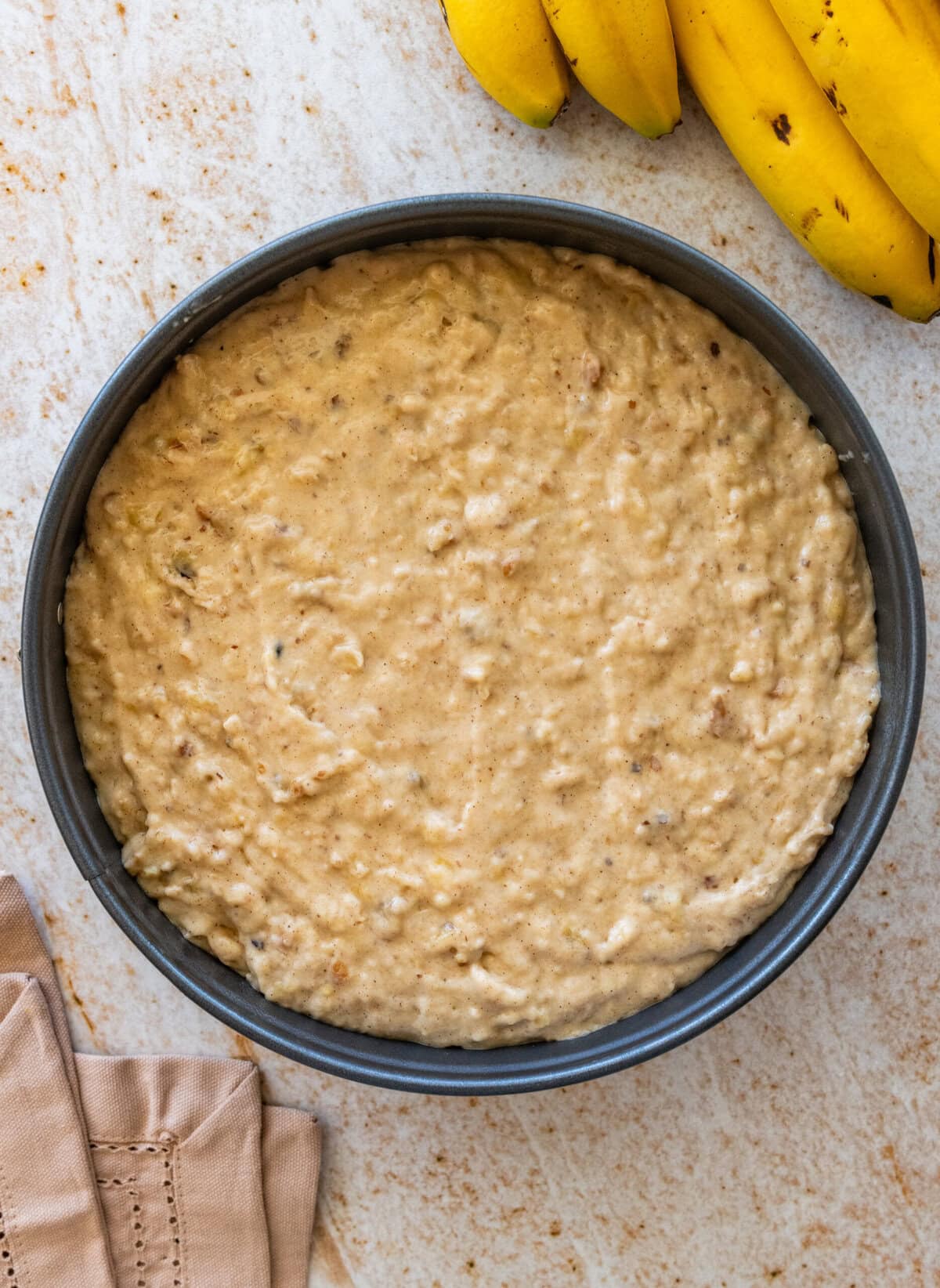The batter in a prepared cake pan.