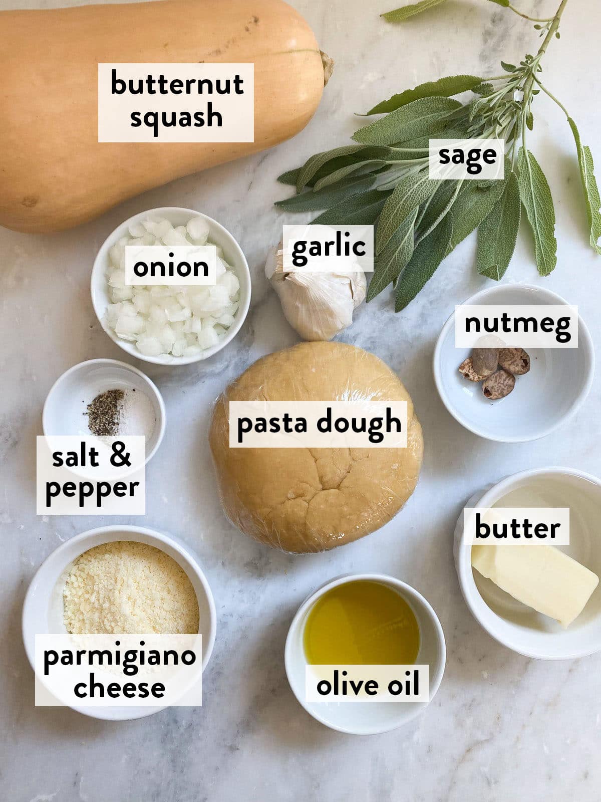 bowls of ingredients for butternut squash ravioli on a marble countertop.