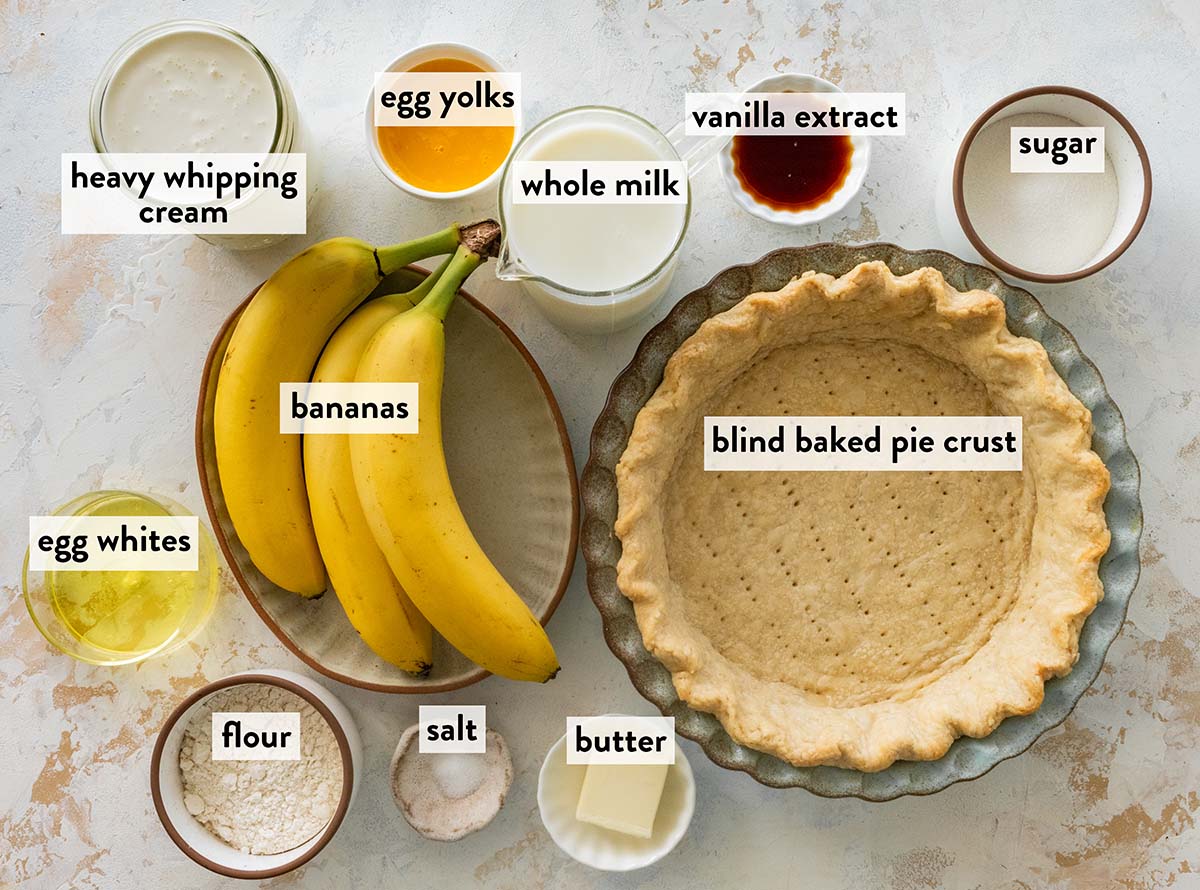 bowls of ingredients for banana cream pie on a marble counter.