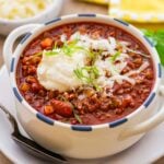 bowl of beef and bean chili with a spoon.