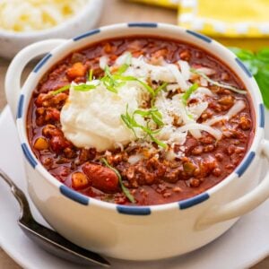 bowl of beef and bean chili with a spoon.