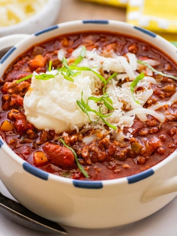 bowl of beef and bean chili with a spoon.