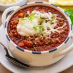 bowl of beef and bean chili with a spoon.