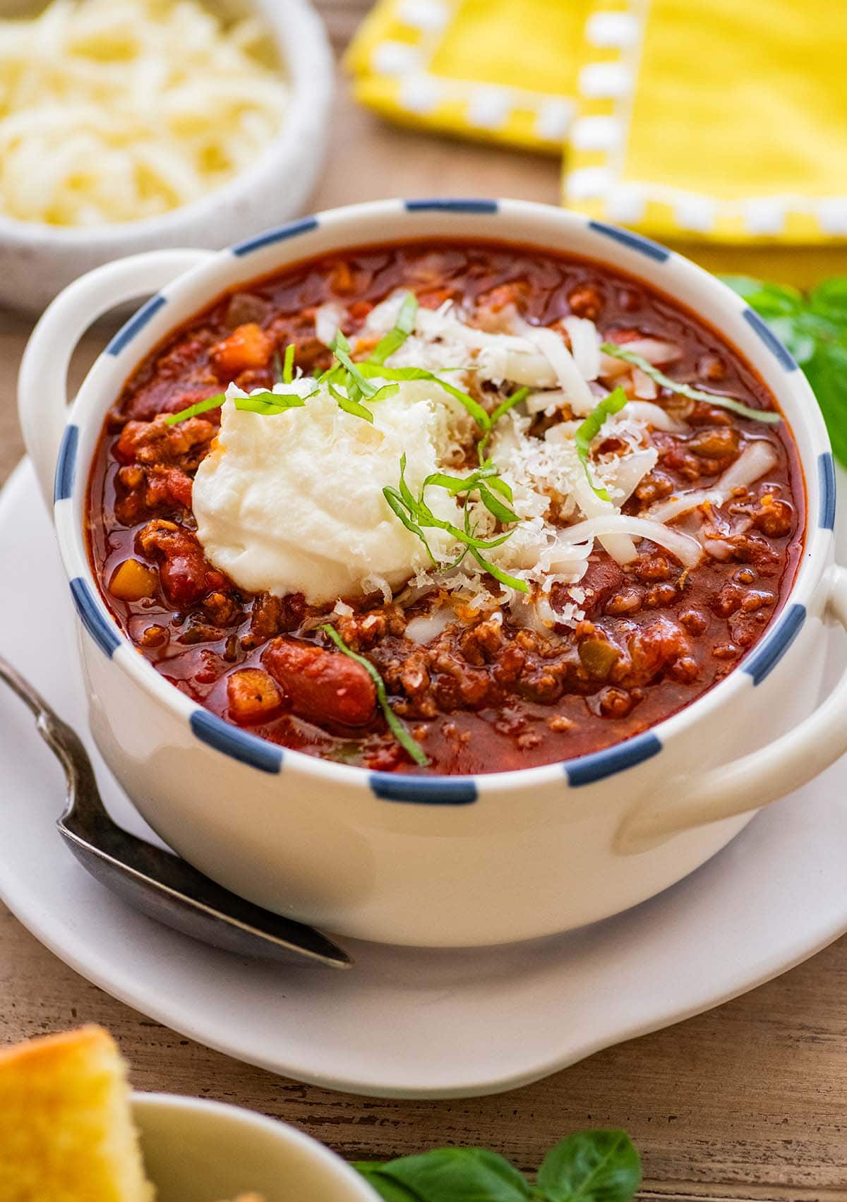 bowl of beef and bean chili with a spoon.