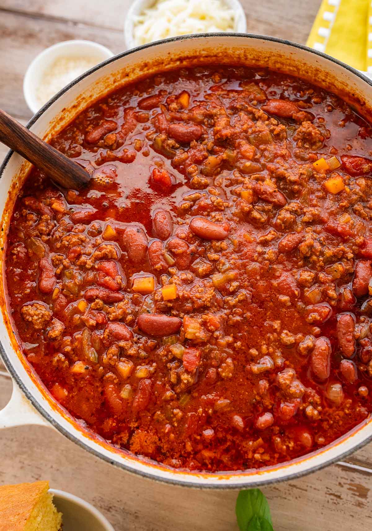 pot of chili with a wooden spoon in it.