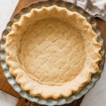 baked Crisco pie crust in a ceramic pie plate.