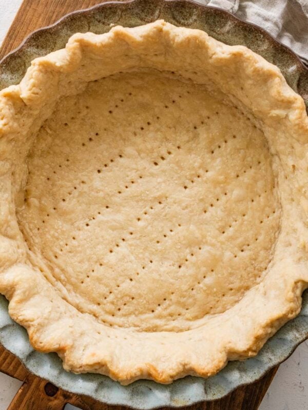 baked Crisco pie crust in a ceramic pie plate.