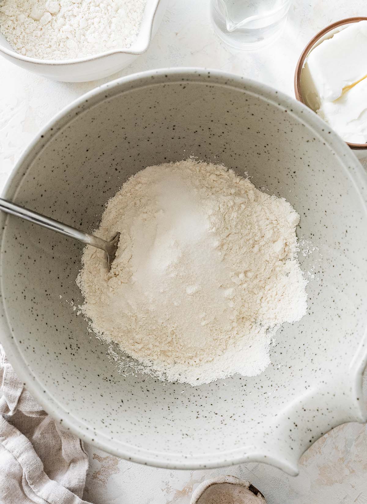 mixing the flour and salt together in a large mixing bowl.