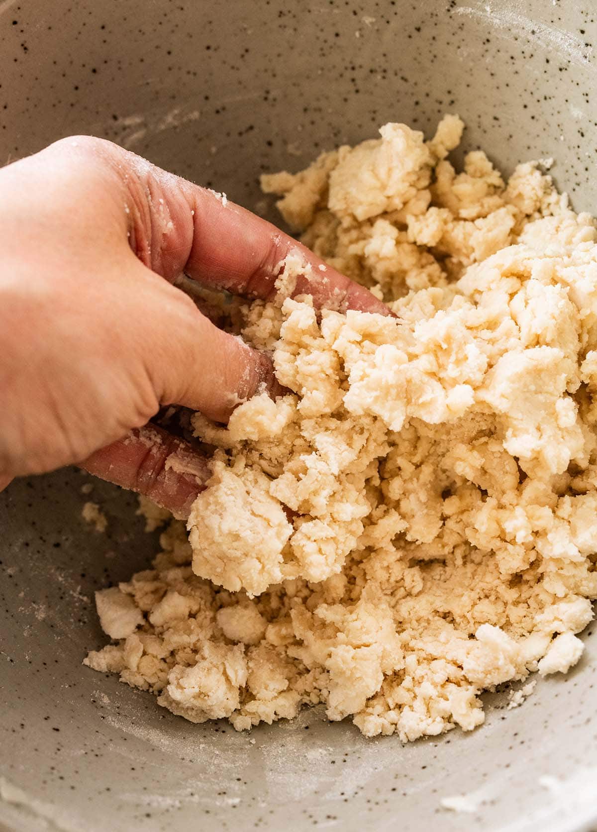 mixing the crisco into the flour and salt mixture.
